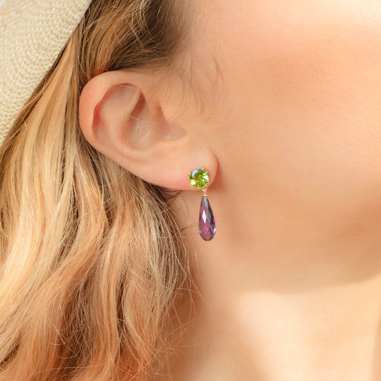 British Jewellers designed London-made custom gold jewellery - Close up of the model demonstrating the wear of the Purple Amethyst and Peridot Gold Drop Earrings– Como Collection, Augustine Jewellery, British Jewellers, Gemstone Jewellery, Luxury Jewellery London.